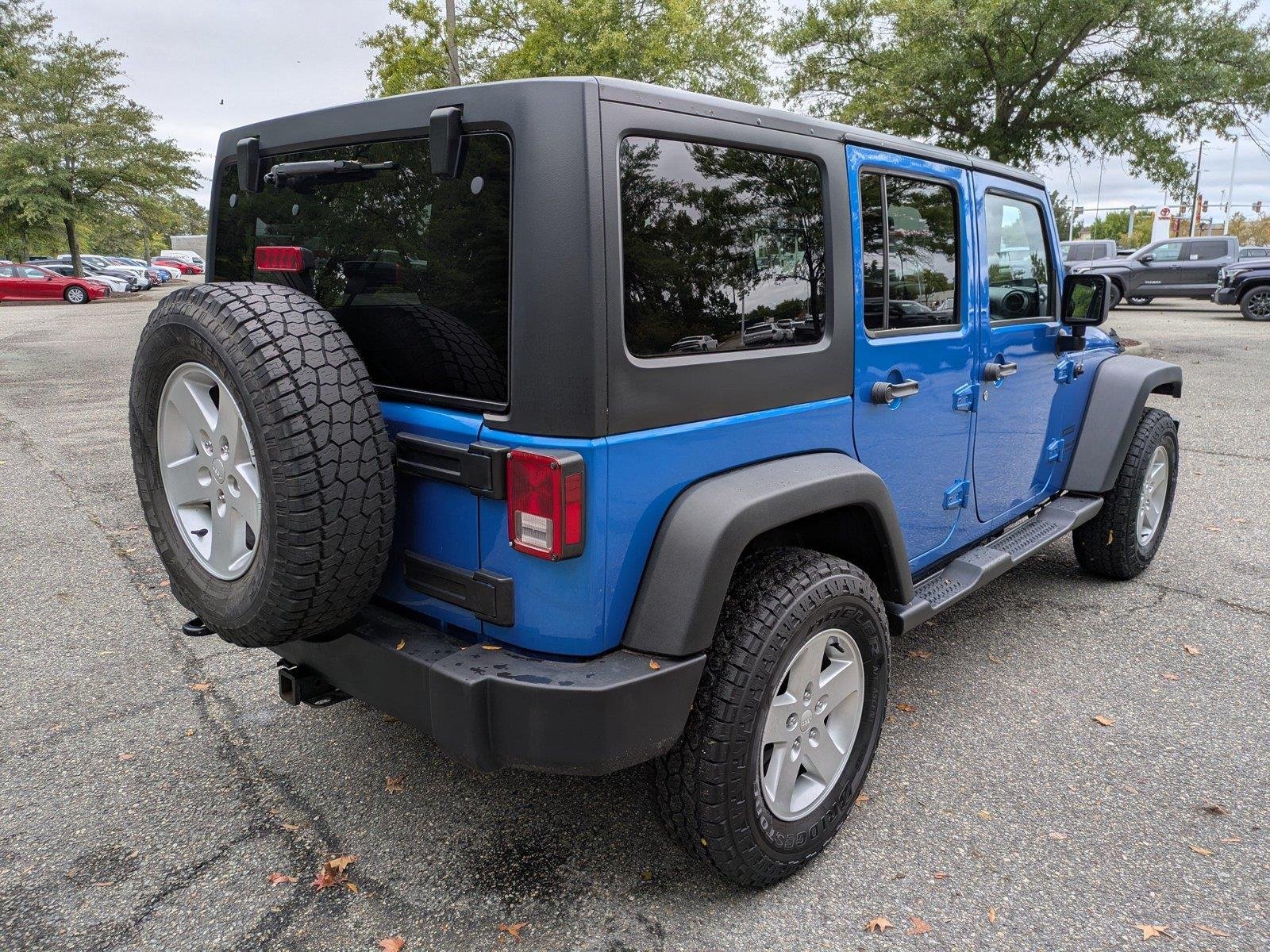 Used 2015 Hydro Blue Pearl Coat Jeep Sport image 4