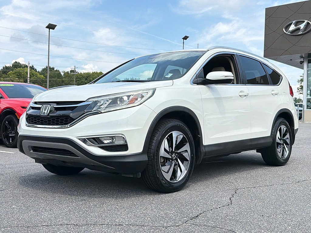 Used 2016 Diamond White Pearl Honda Touring image 1