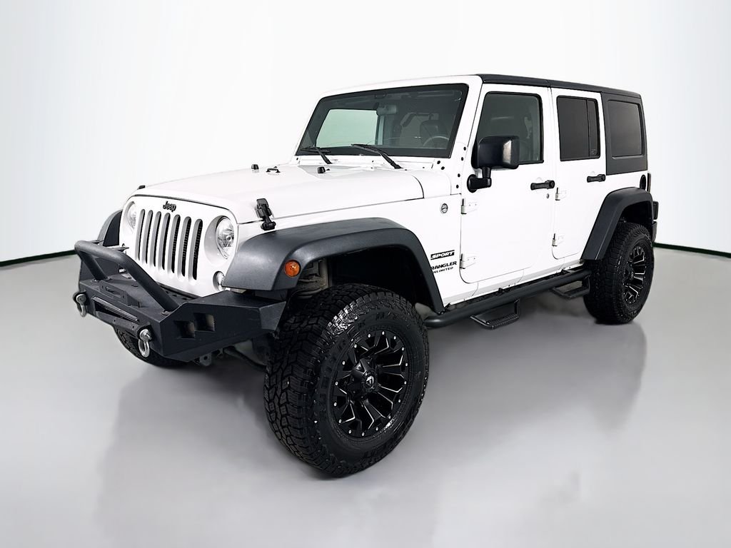 Used 2015 White Jeep Unlimited Sport image 1