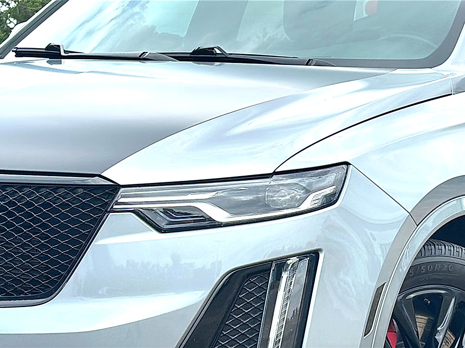 Used 2024 Argent Silver Metallic Cadillac AWD Sport image 4