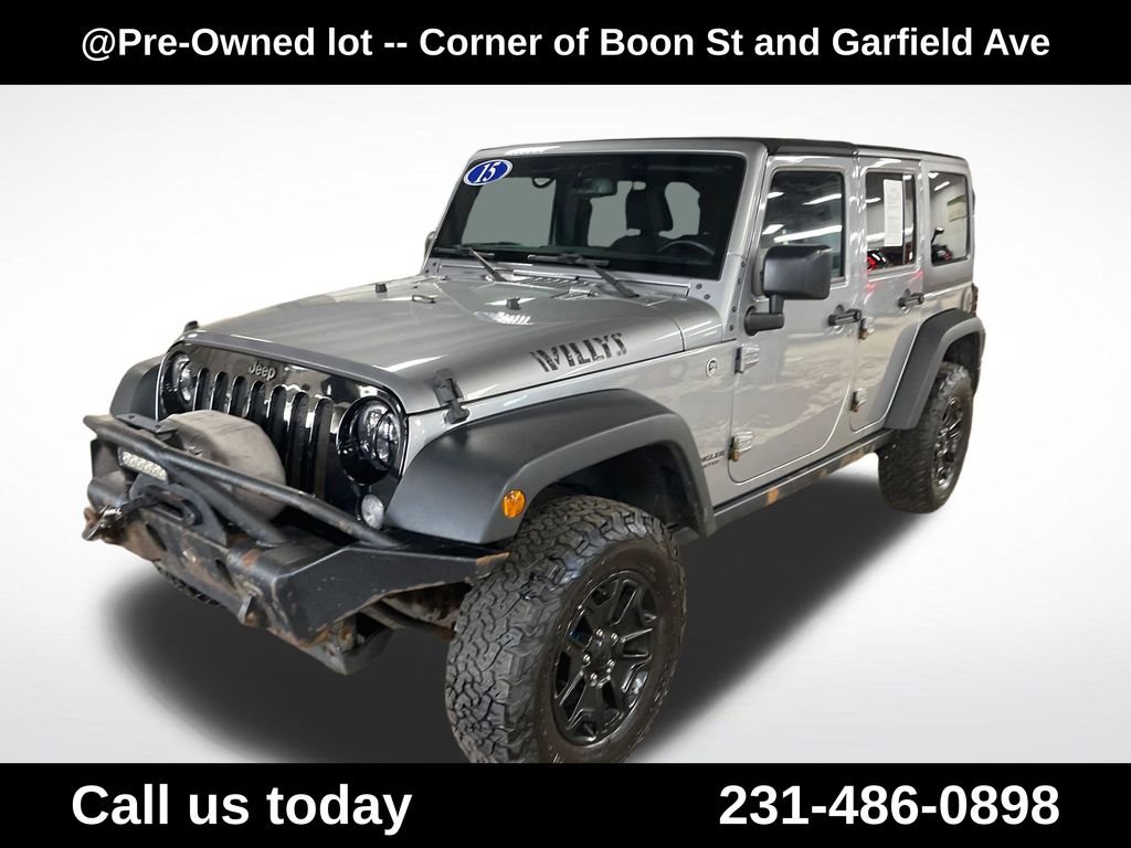 Used 2015 Silver Jeep Unlimited Sport image 1