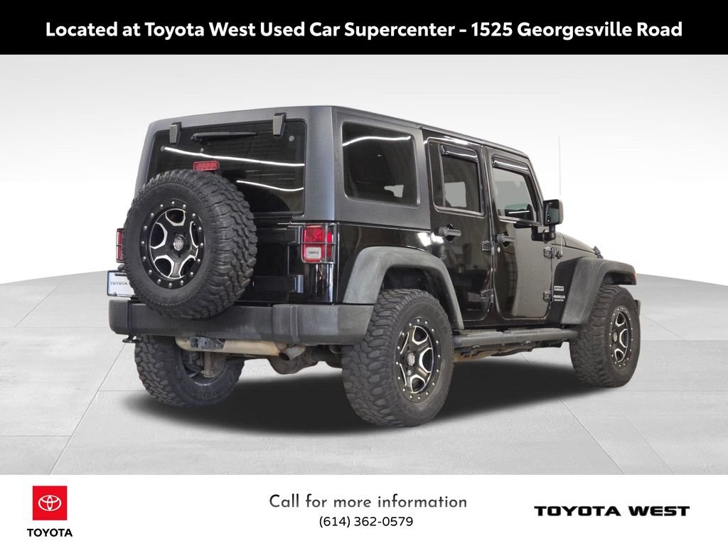 Used 2013 Black Jeep Unlimited Sport image 7