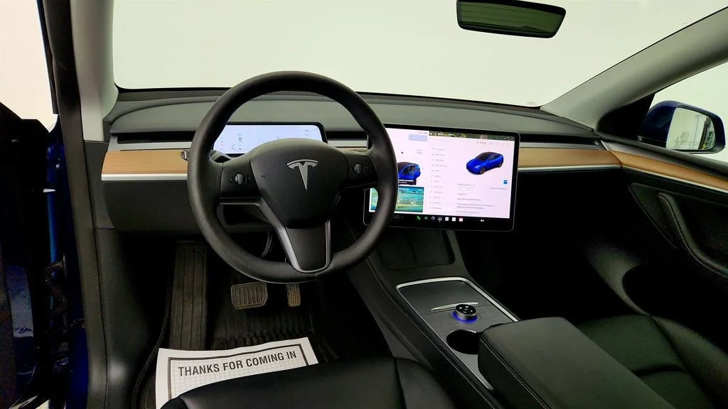Used 2024 Deep Blue Metallic Tesla Long Range AWD w/ Full Self-Driving & Aero Disc Wheel Covers image 12