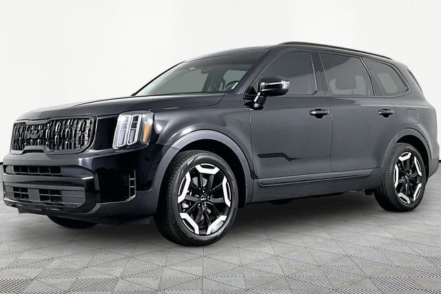 Used 2024 Black Kia EX image 1