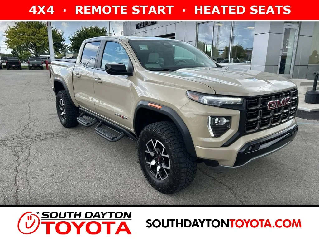 Used 2023 Desert Sand Metallic GMC AT4X image 1