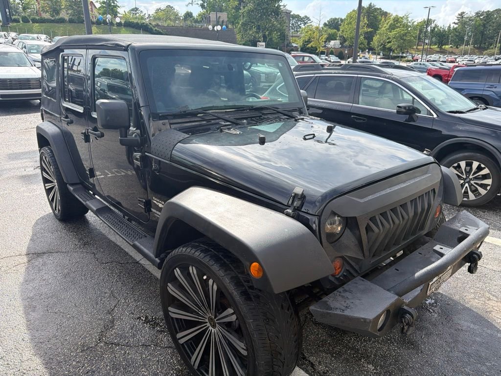 Used 2013 Black Jeep Unlimited Sahara image 6