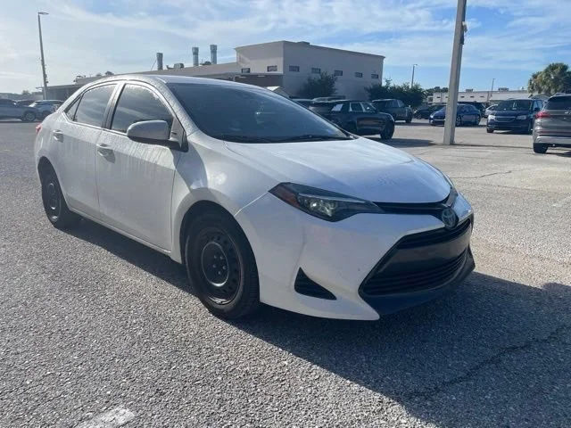 Used 2019 Super White Toyota LE image 1