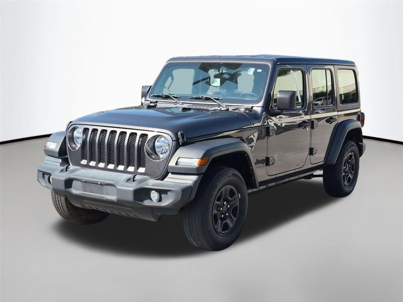 Used 2022 Granite Crystal Metallic Clearcoat Jeep Unlimited Sport image 1