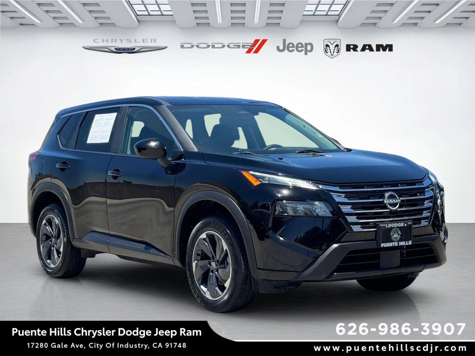 Used 2024 Super Black Nissan SV image 1