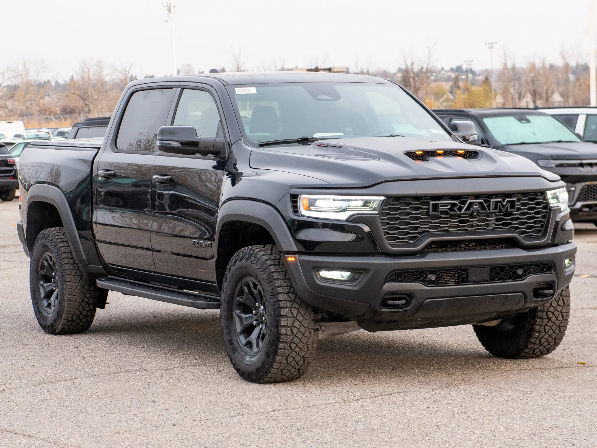 New 2026 Black RAM RHO* Crew Cab 4x4, 540HP, 35 Inch Tires, Massage Seats, Passenger Screen image 10