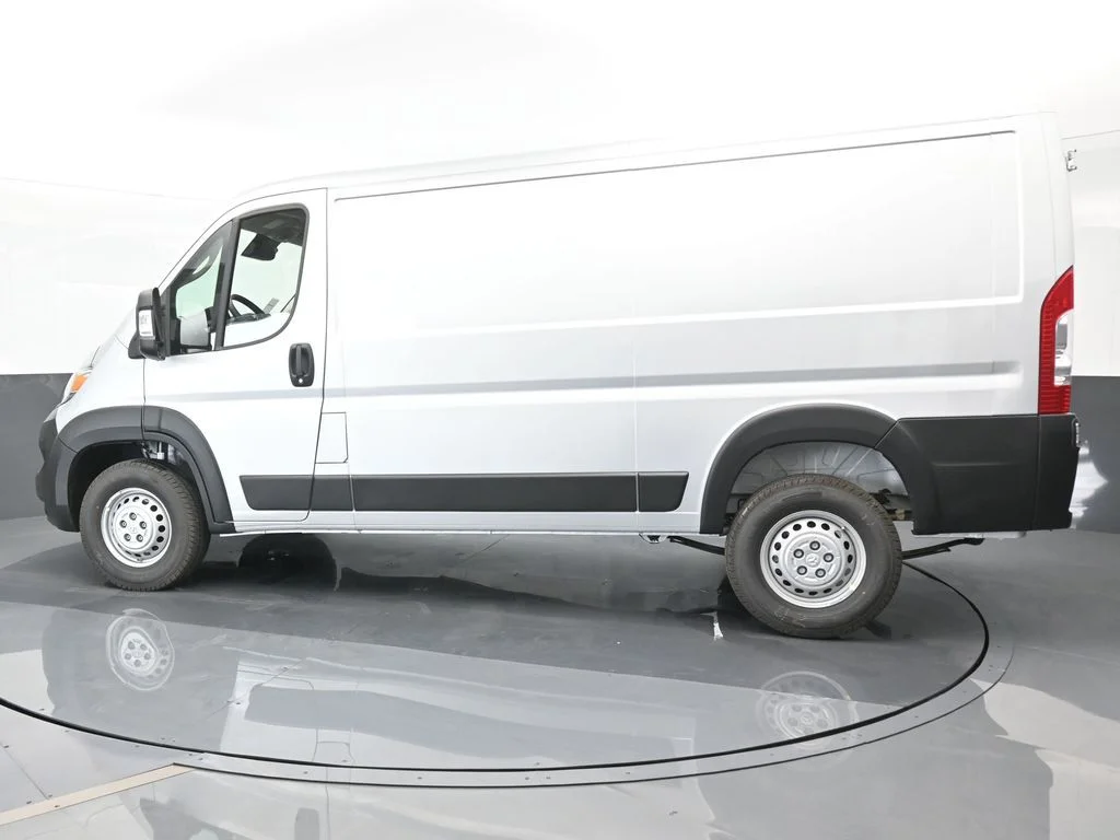 Used 2025 Bright Silver Clearcoat Metallic Ram Low Roof image 3