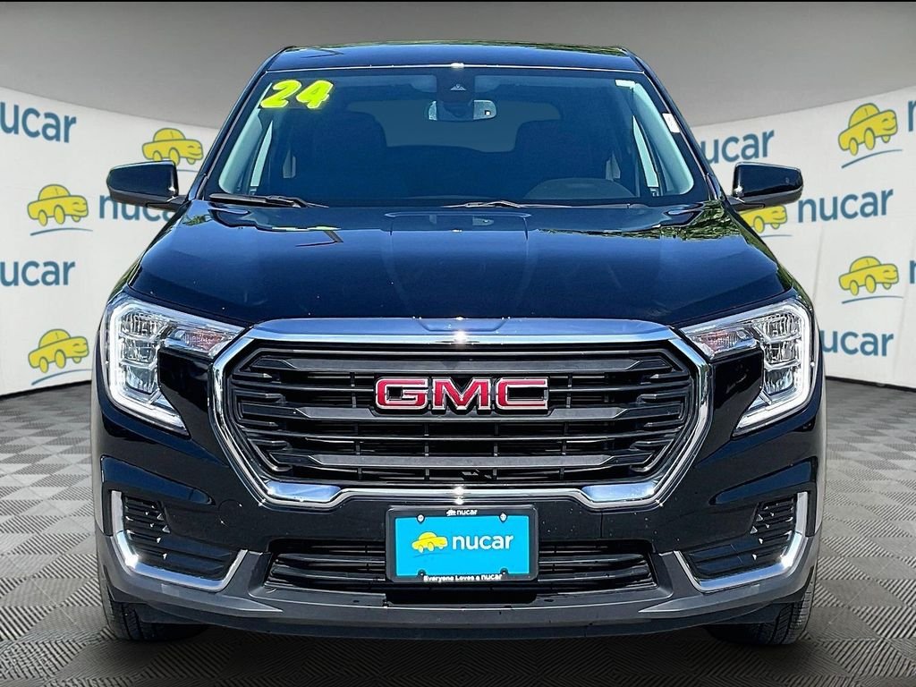 Used 2024 Ebony Twilight Metallic GMC SLE image 2