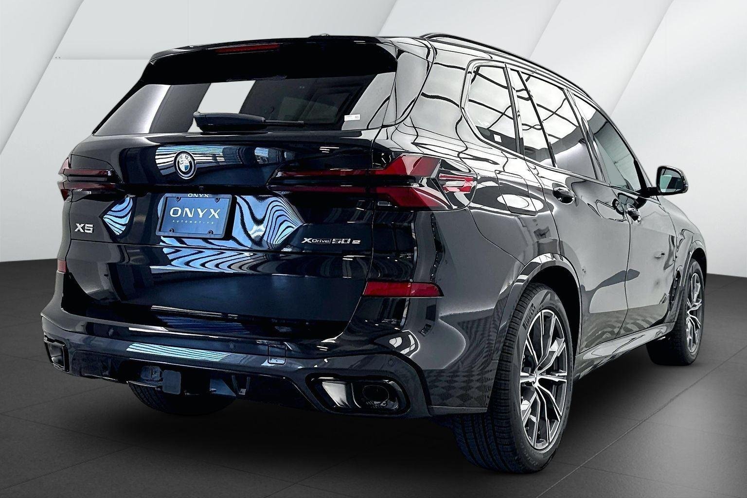 New 2026 Black Sapphire Metallic BMW xDrive50e image 5