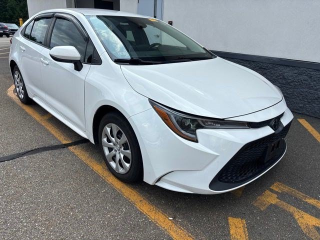 Used 2020 Super White Toyota LE image 1