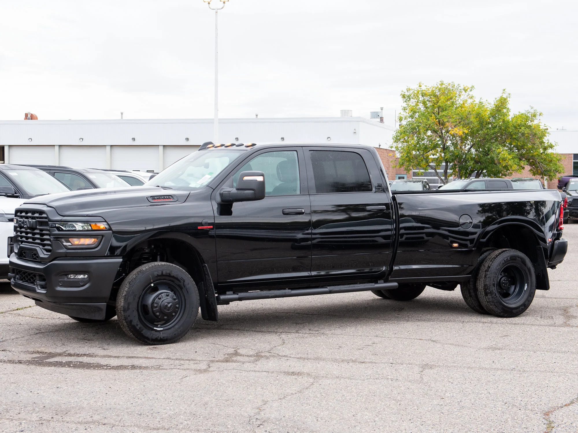 New 2026 Black RAM Tradesman* Crew Cab 4x4, 8