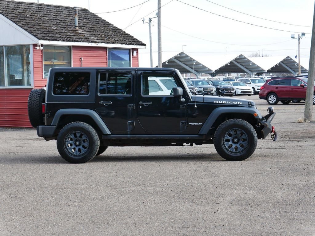 Used 2013 Jeep Wrangler Unlimited Rubicon with VIN 1C4HJWFGXDL607664 for sale in White Bear Lake, Minnesota