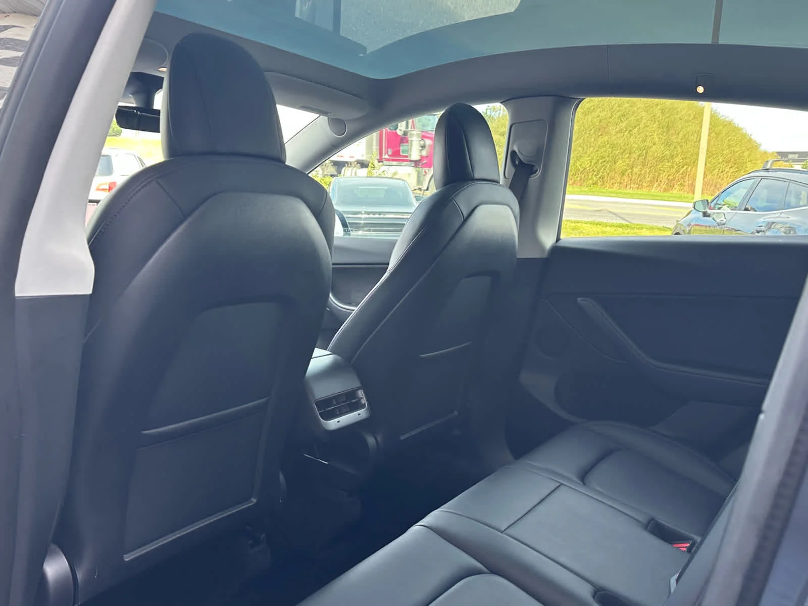 Used 2022 Solid Black Tesla Performance image 8