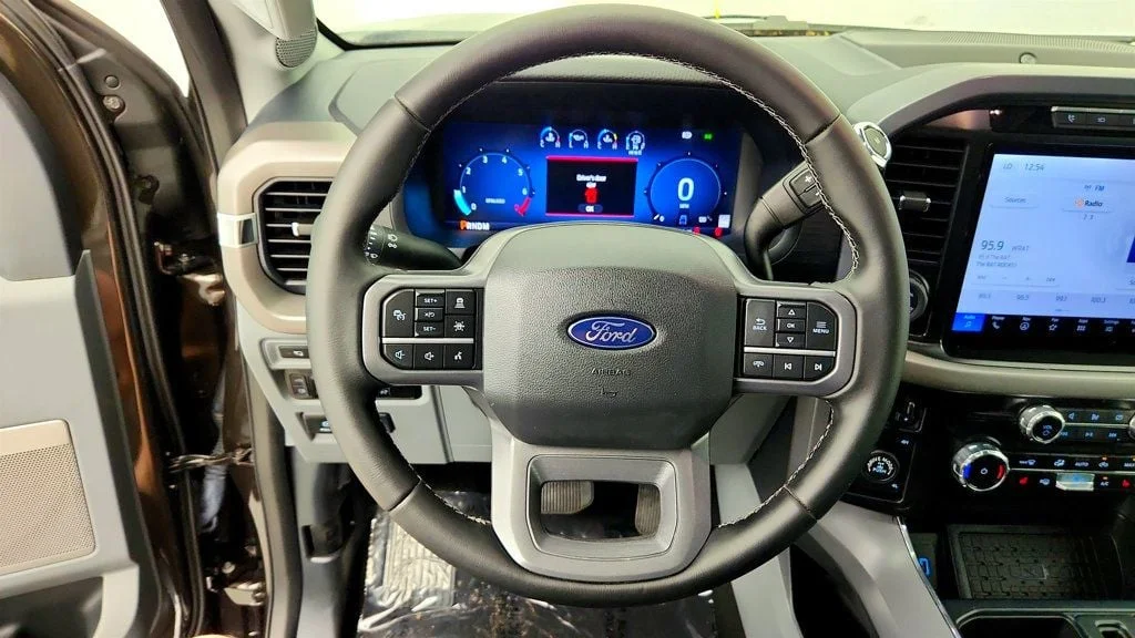Used 2024 Darkened Bronze Metallic Ford XLT 4WD SuperCrew 5.5