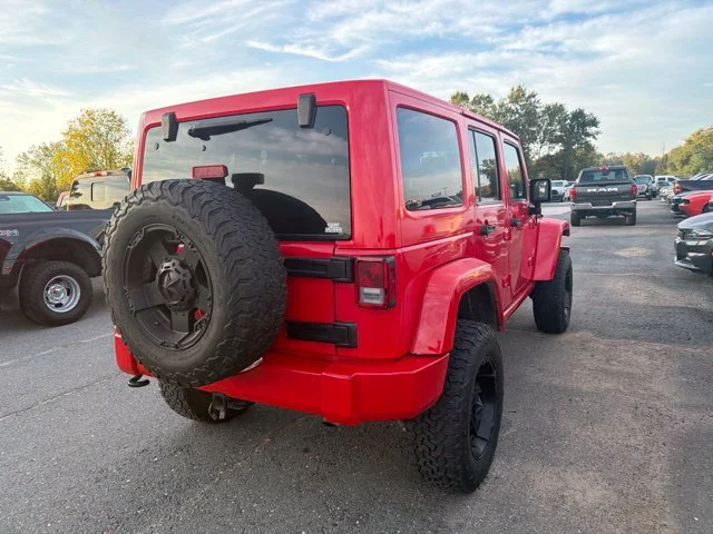 Used 2015 Red Jeep Unlimited Sahara image 7