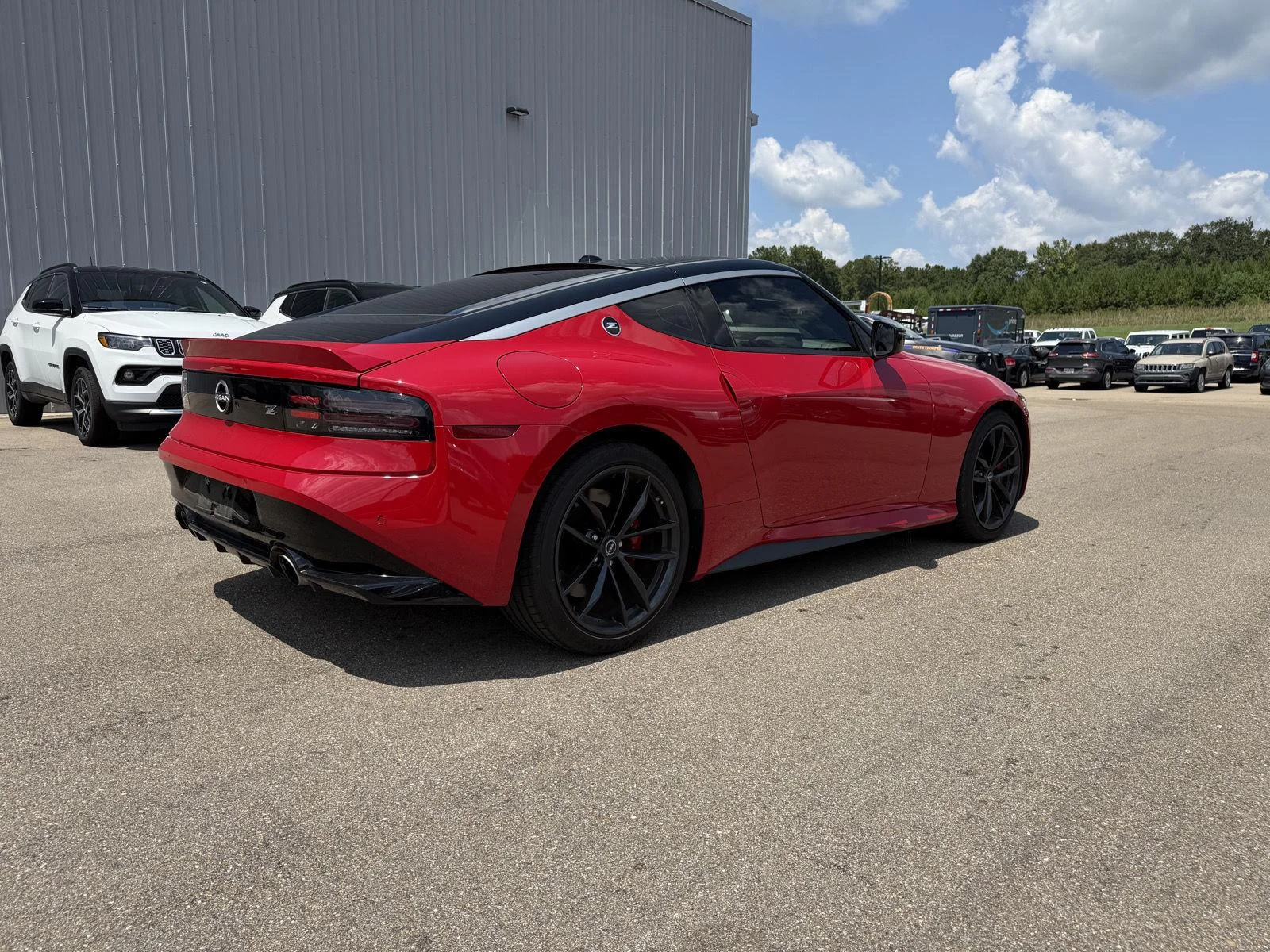 Used 2025 Solid Red/Super Black Nissan Performance image 6