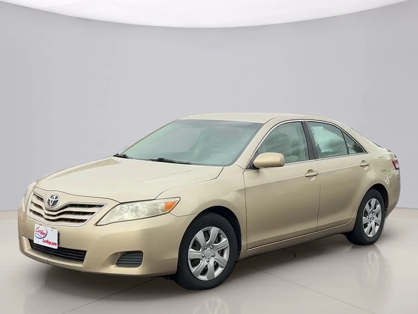 Used 2011 Gold Toyota LE image 1