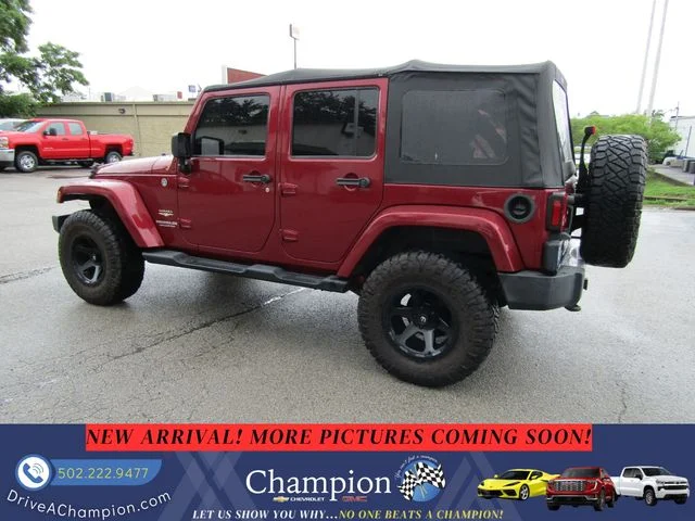 Used 2013 Red Jeep Unlimited Sahara image 6