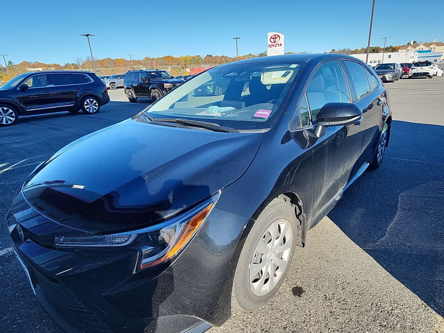 Used 2024 Midnight Black Metallic Toyota LE image 2