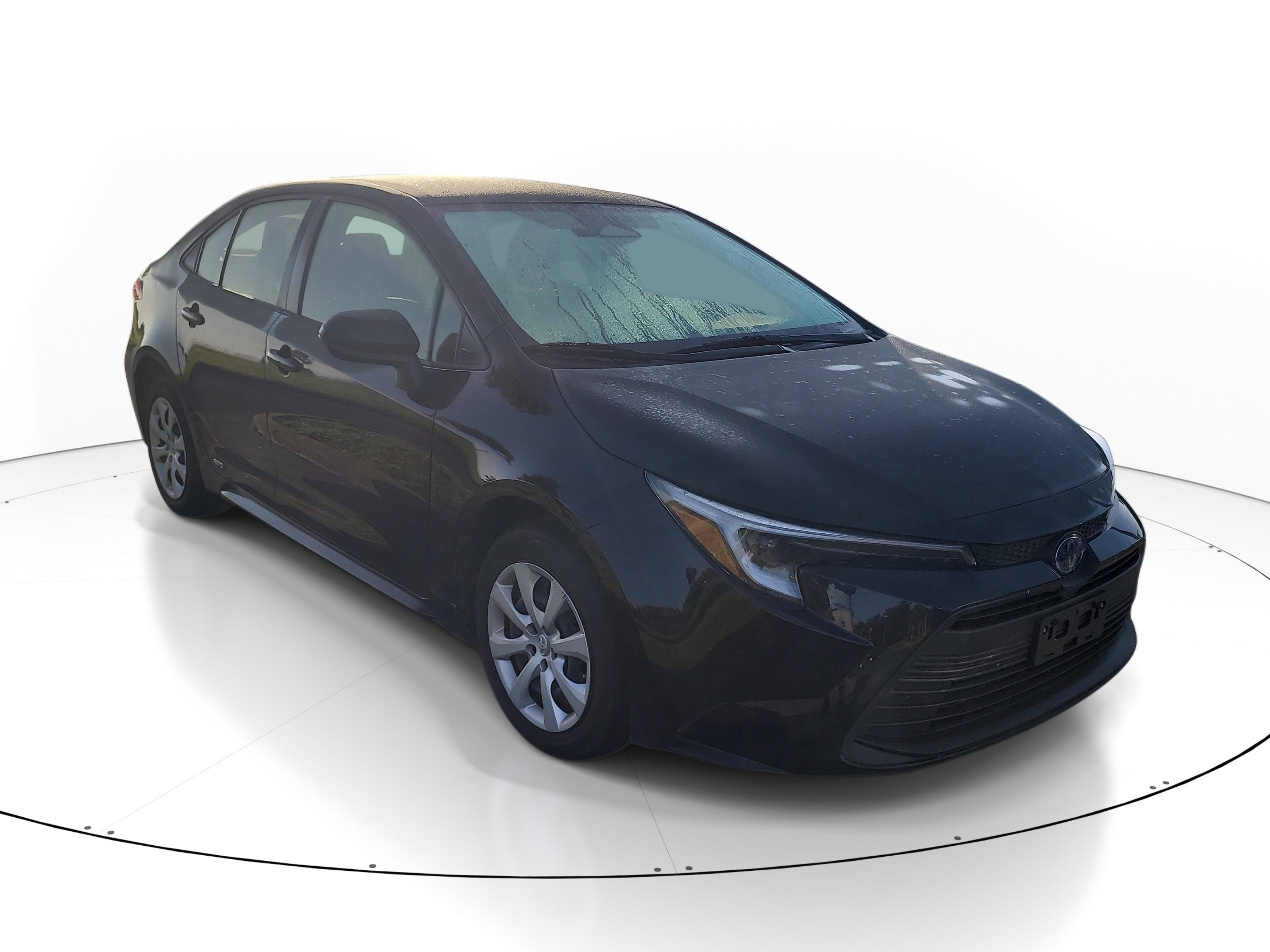 Used 2023 Midnight Black Metallic Toyota Hybrid LE image 1