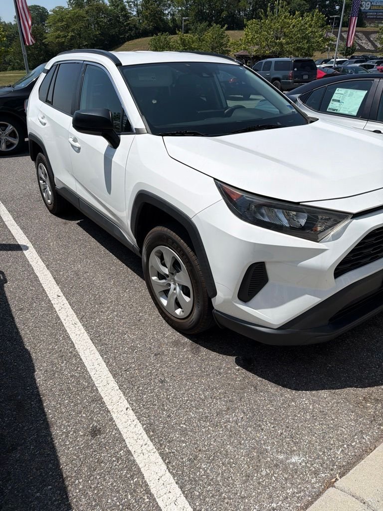 Used 2021 White Toyota LE image 1