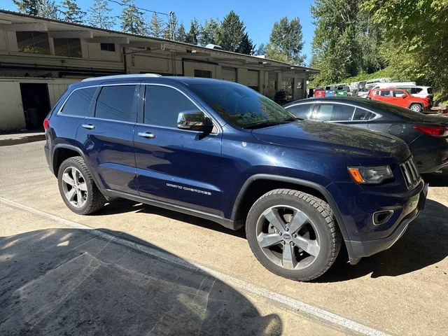 Used 2014 True Blue Pearlcoat Jeep Limited image 1