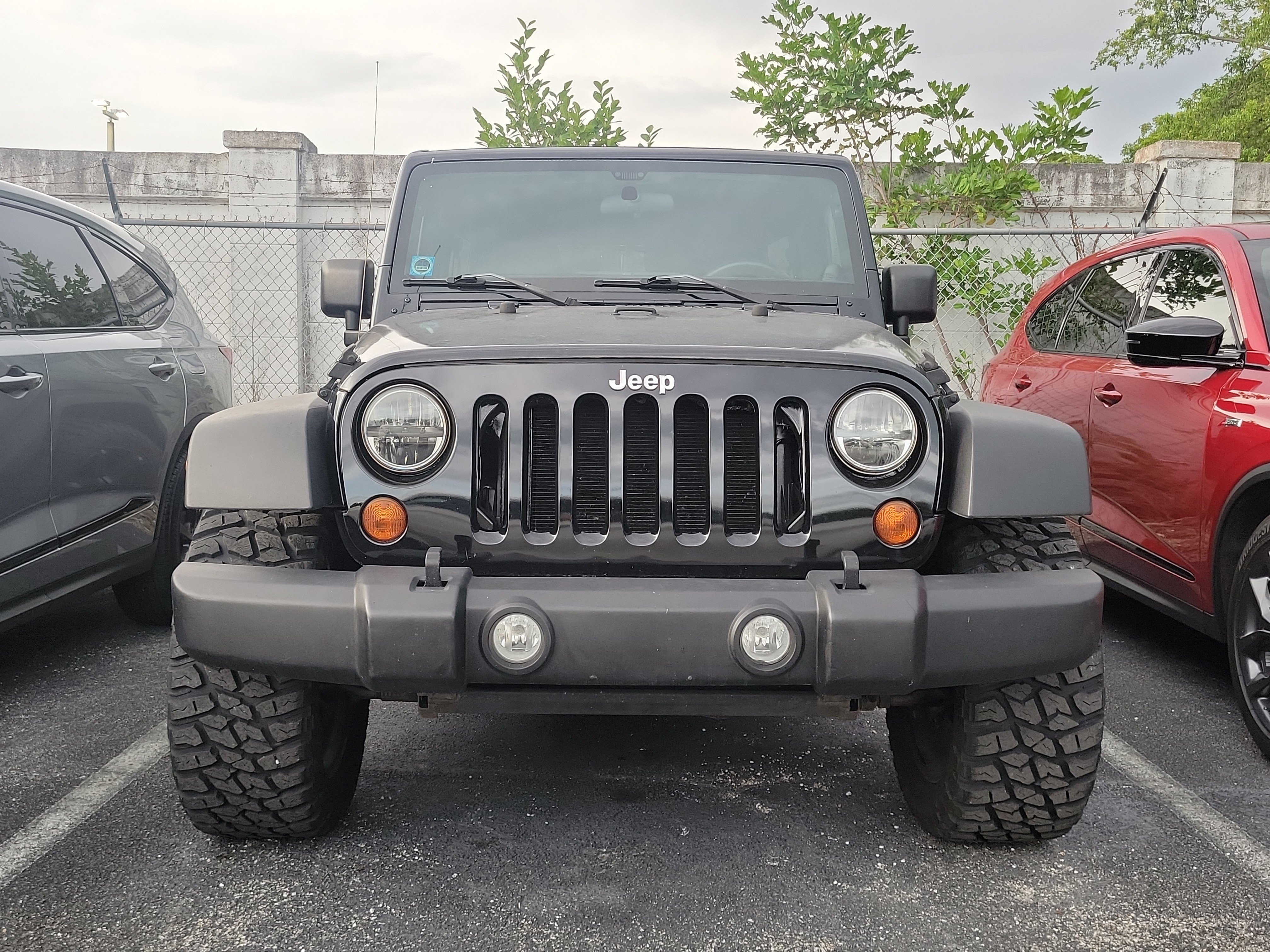 Used 2011 Black ClearCoat Jeep Unlimited Sport image 2