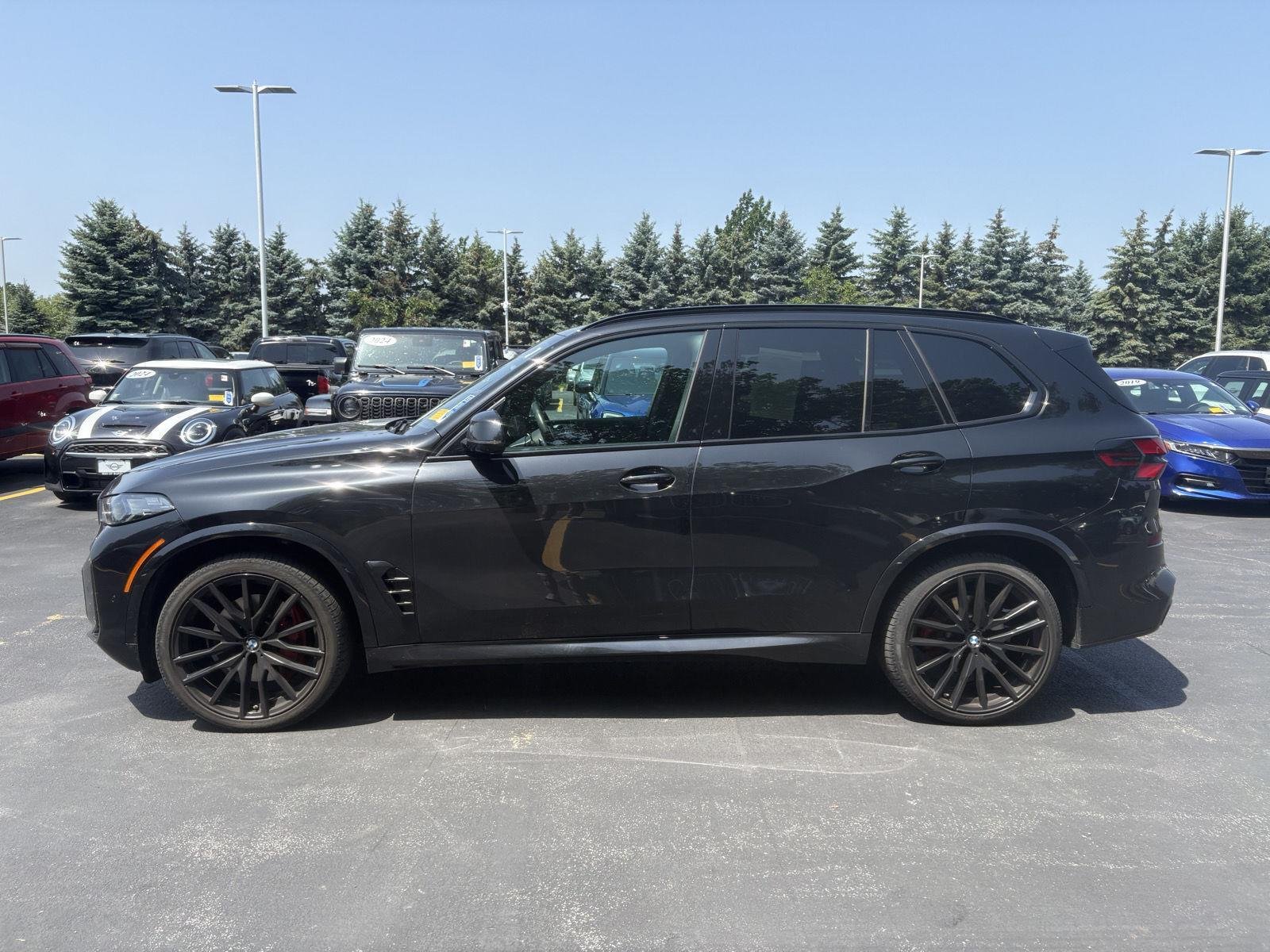 Certified Used 2025 Black Sapphire Metallic BMW xDrive40i image 5