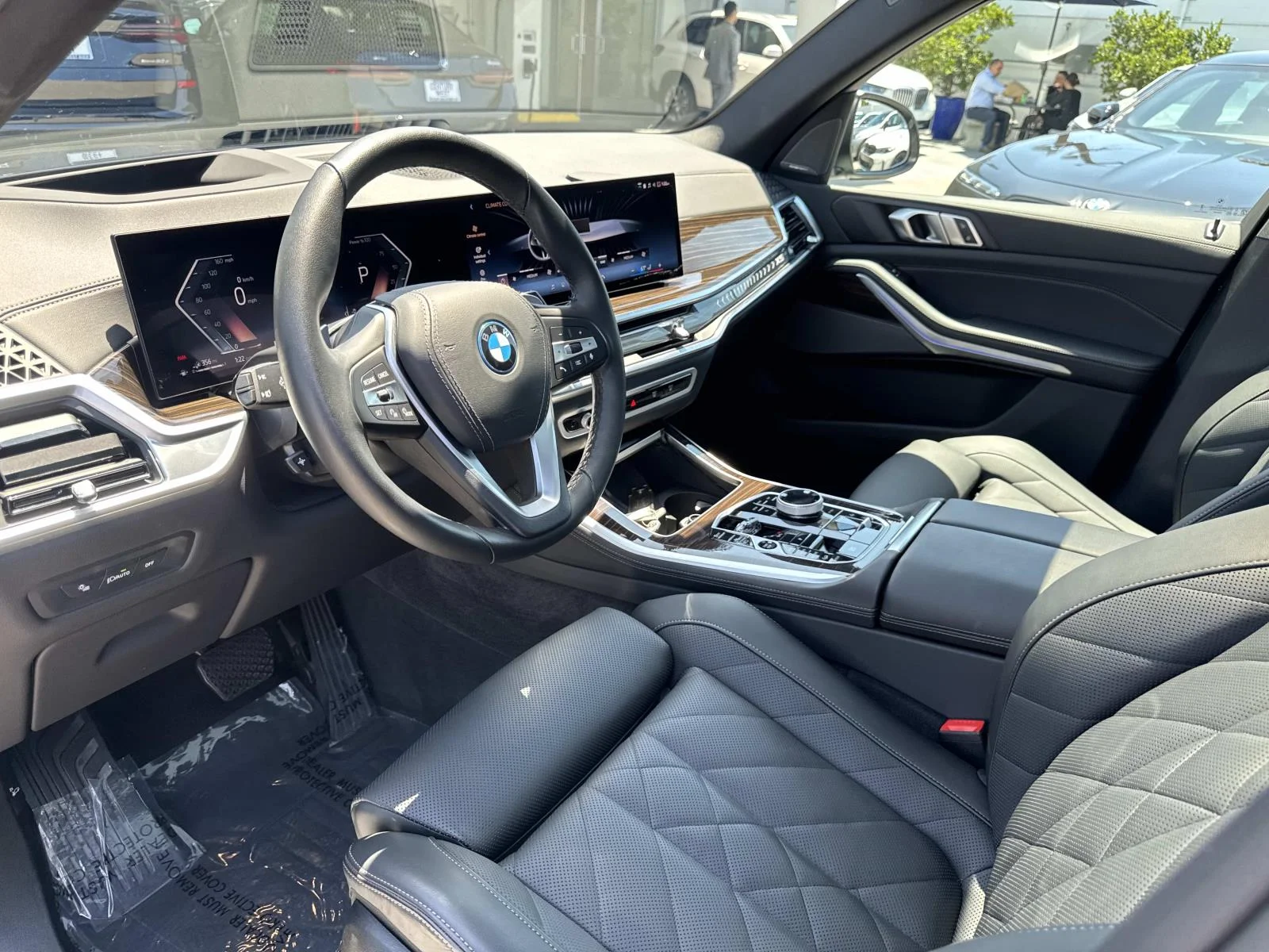 Used 2026 Black Sapphire Metallic BMW xDrive50e Plug-In Hybrid image 16