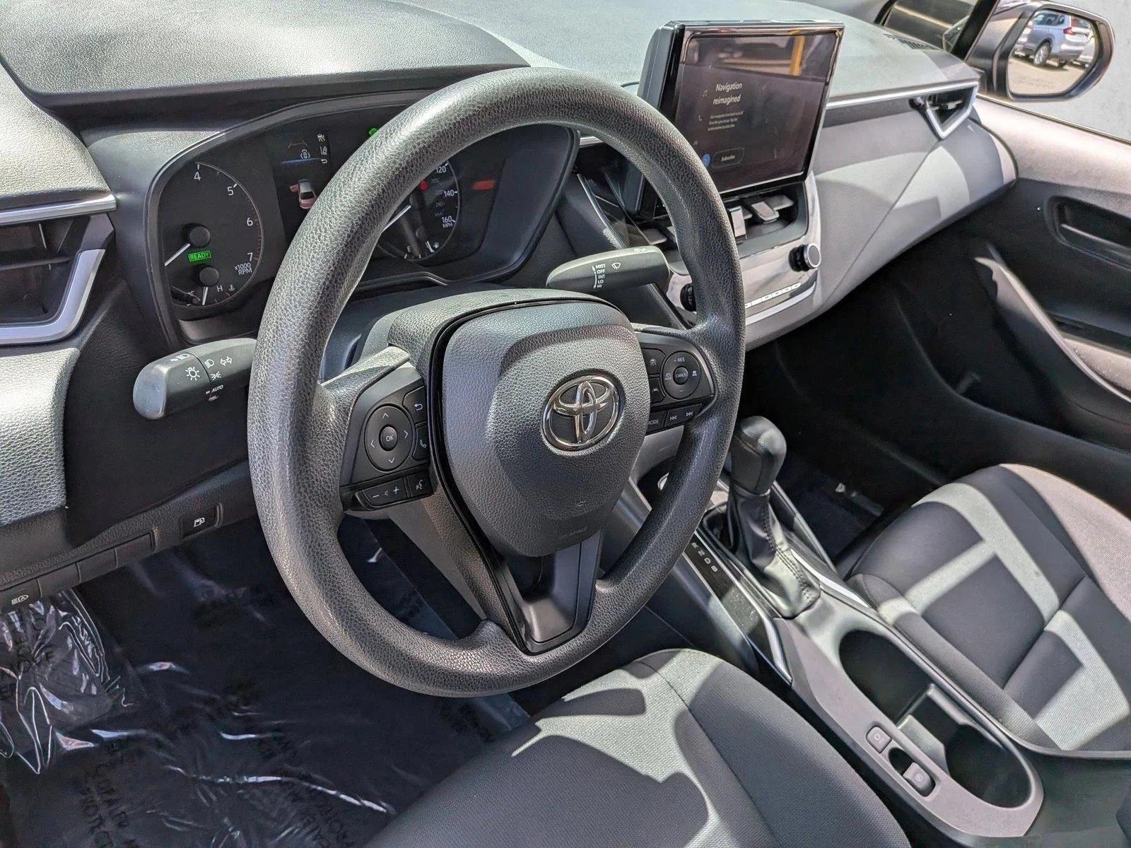 Used 2024 Midnight Black Metallic Toyota Hybrid LE image 10