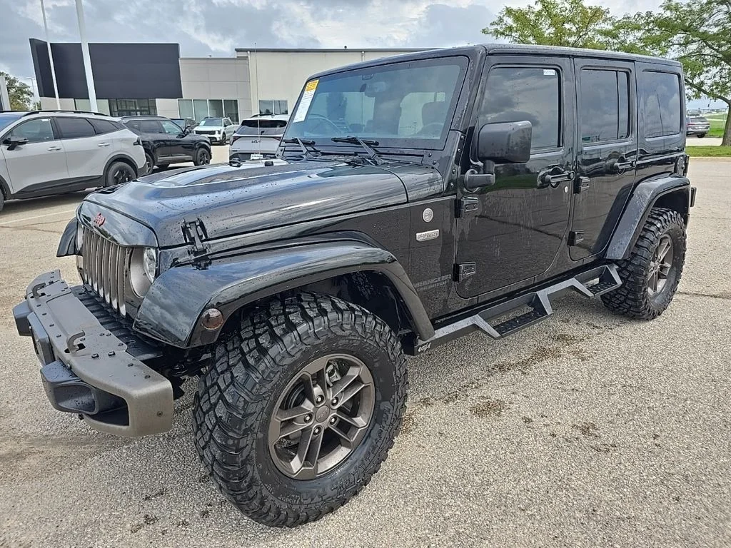 Used 2016 Black Jeep Unlimited Sahara image 4