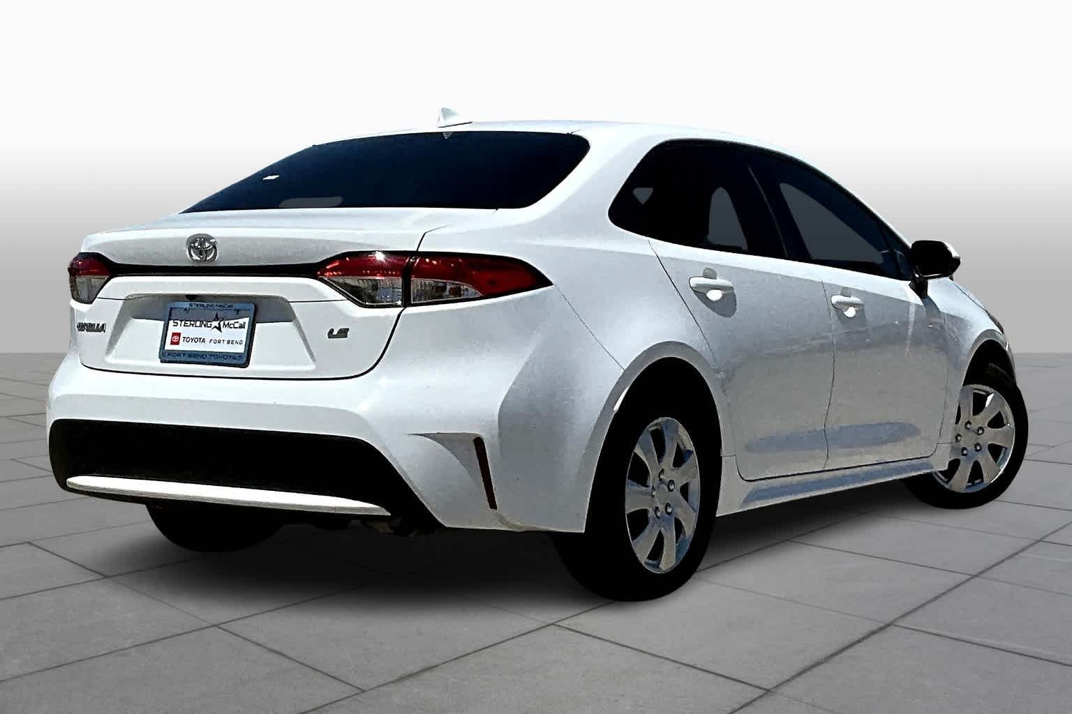 Used 2021 Super White Toyota LE image 13