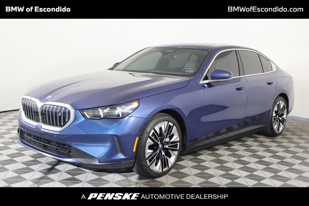 Used 2024 Phytonic Blue Metallic BMW eDrive40 image 1