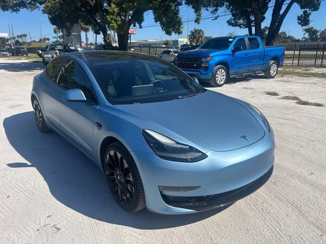 Used 2021 Solid Black Tesla Standard Range Plus image 1