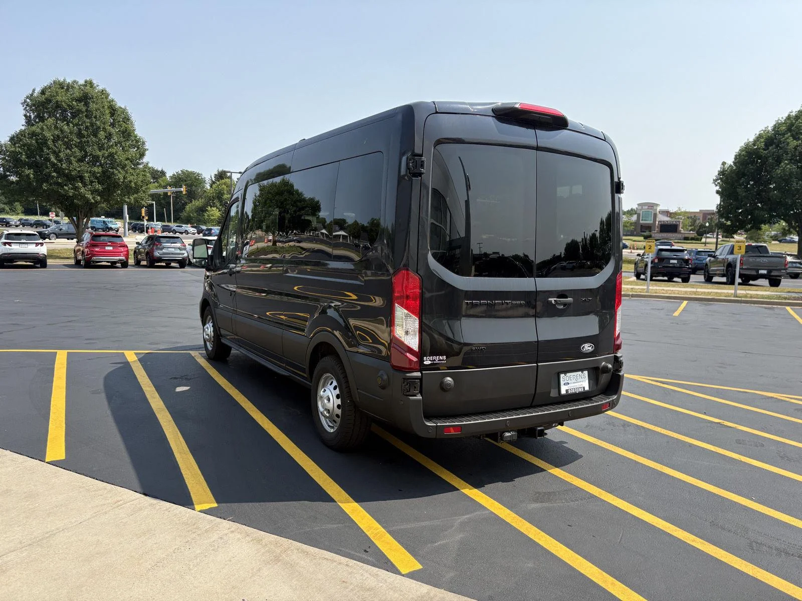 New 2026 Agate Black Metallic Ford Passenger Van XLT image 4