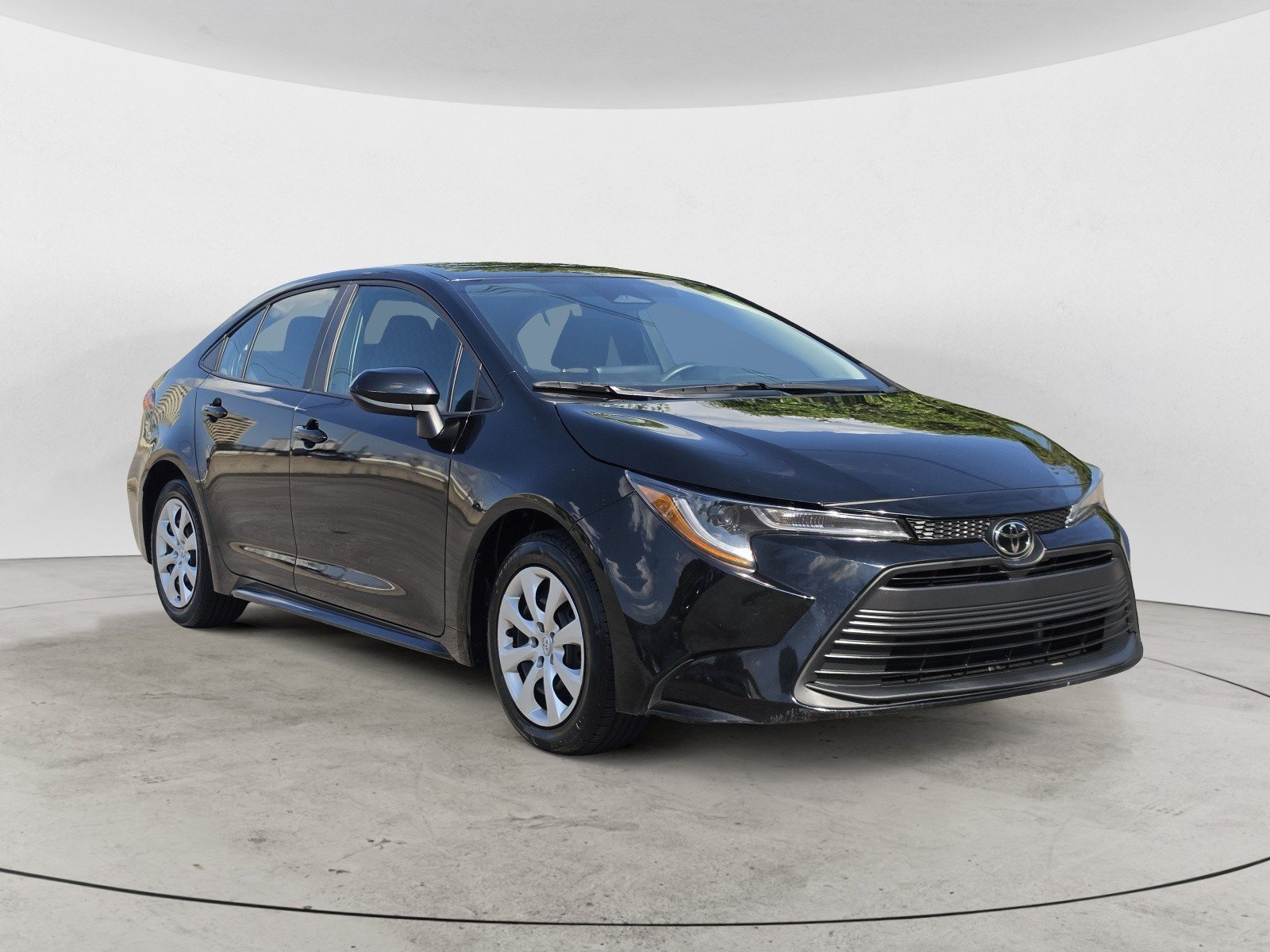 Used 2024 Midnight Black Metallic Toyota LE image 2