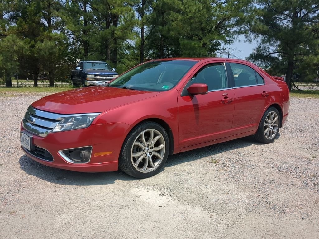 Used 2010 Red Ford SEL image 1