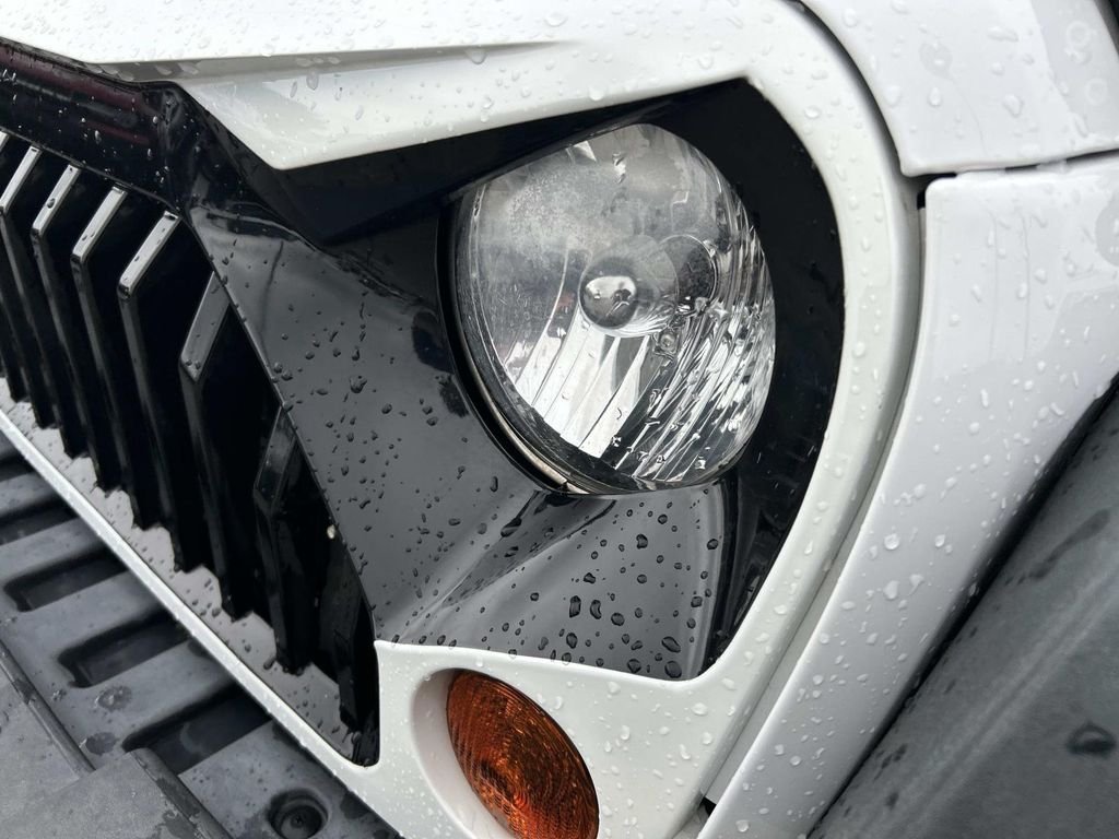 Used 2012 Bright White Jeep Unlimited Sport image 10