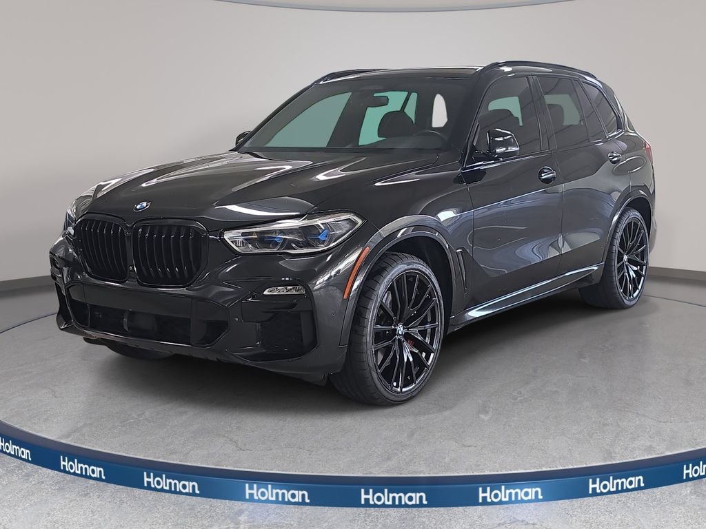 Used 2021 Black Sapphire Metallic BMW sDrive40i image 1