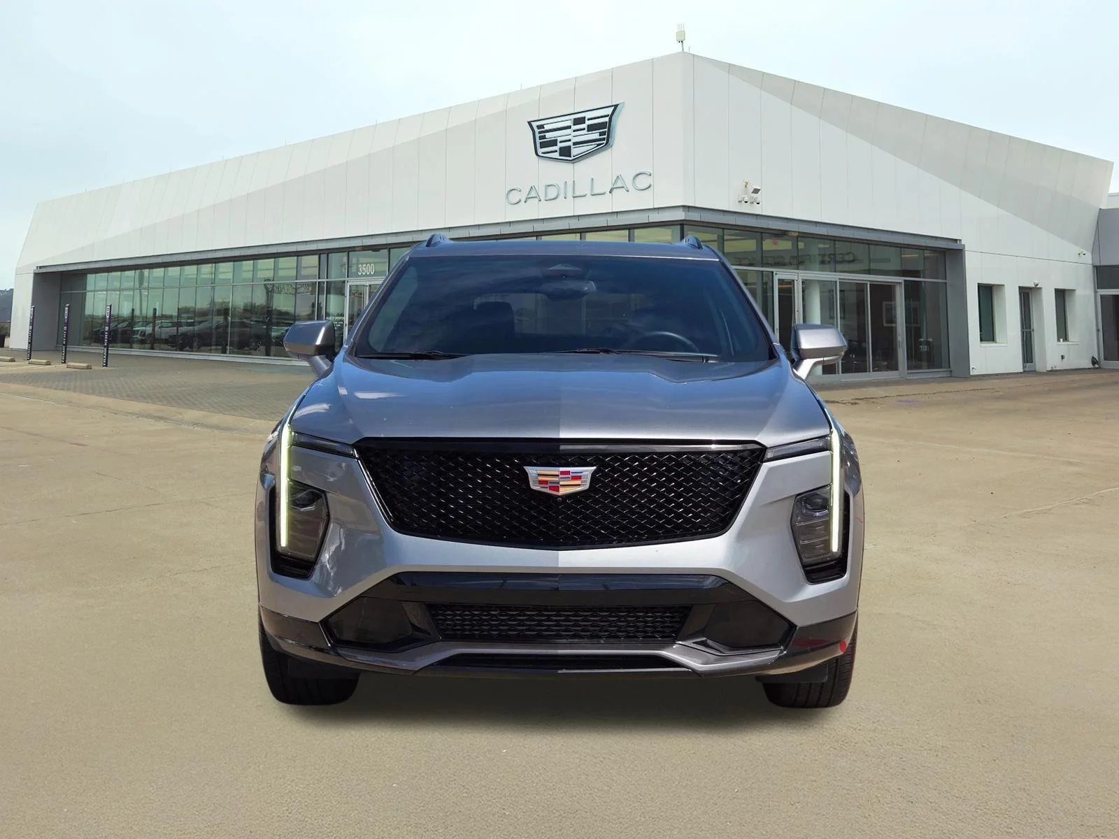 Used 2025 Argent Silver Metallic Cadillac FWD Sport image 2