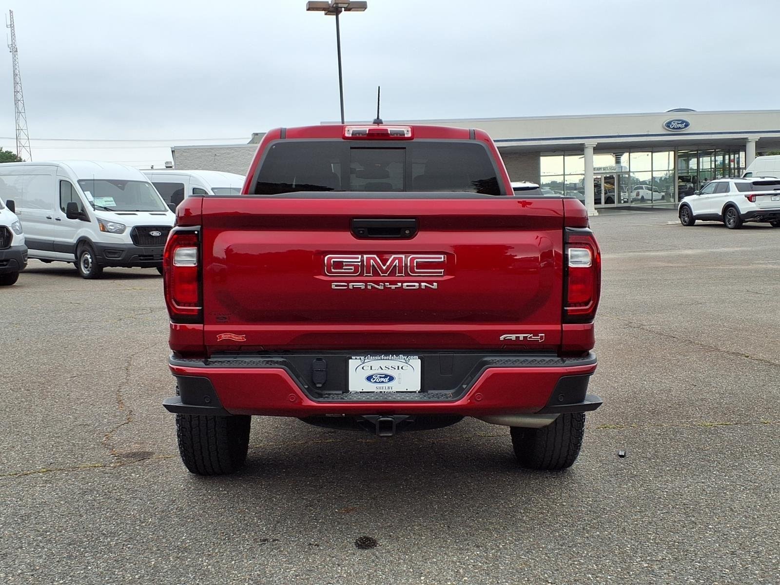 Used 2025 Volcanic Red Tintcoat GMC 4WD AT4 image 10