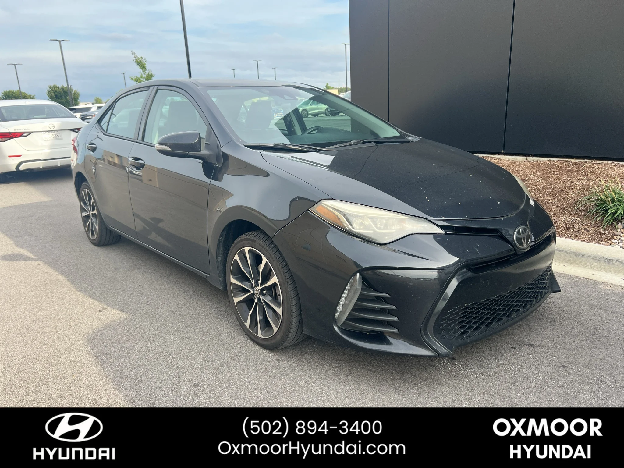 Used 2019 Black Sand Pearl Toyota SE image 1