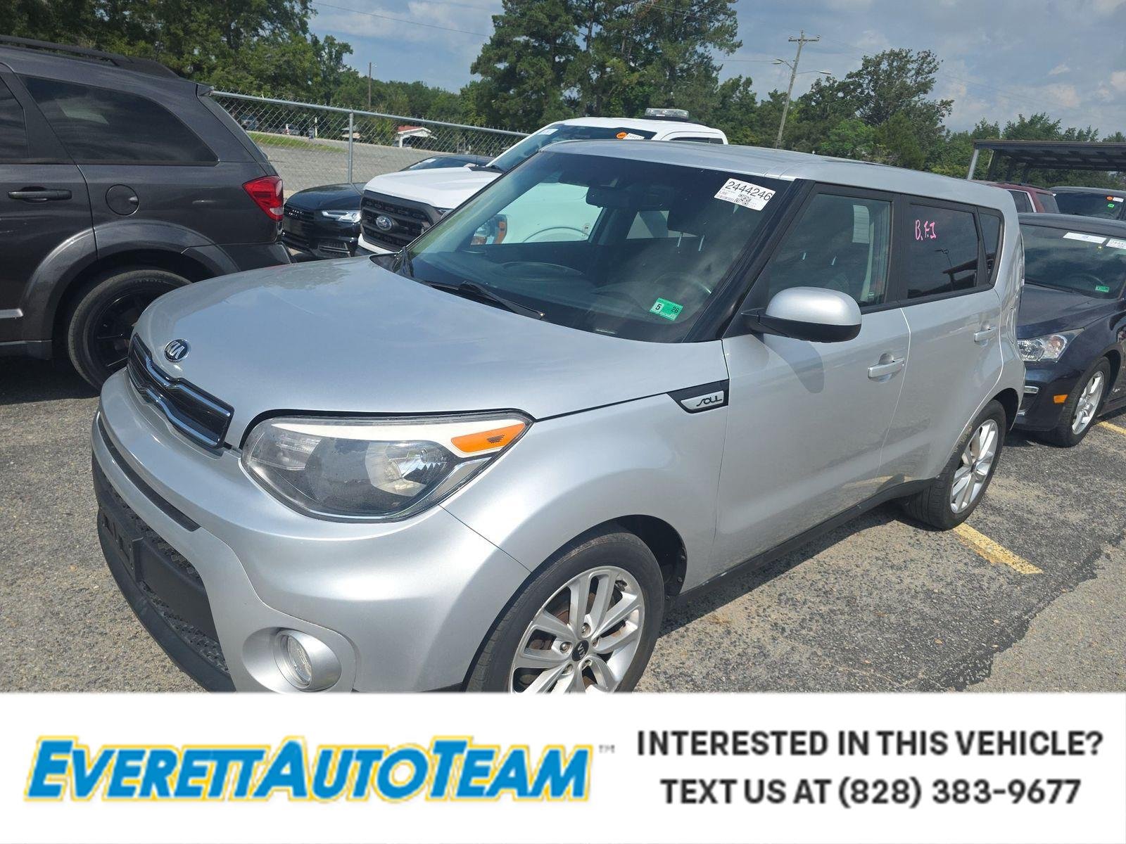 Used 2018 Bright Silver Kia + image 1