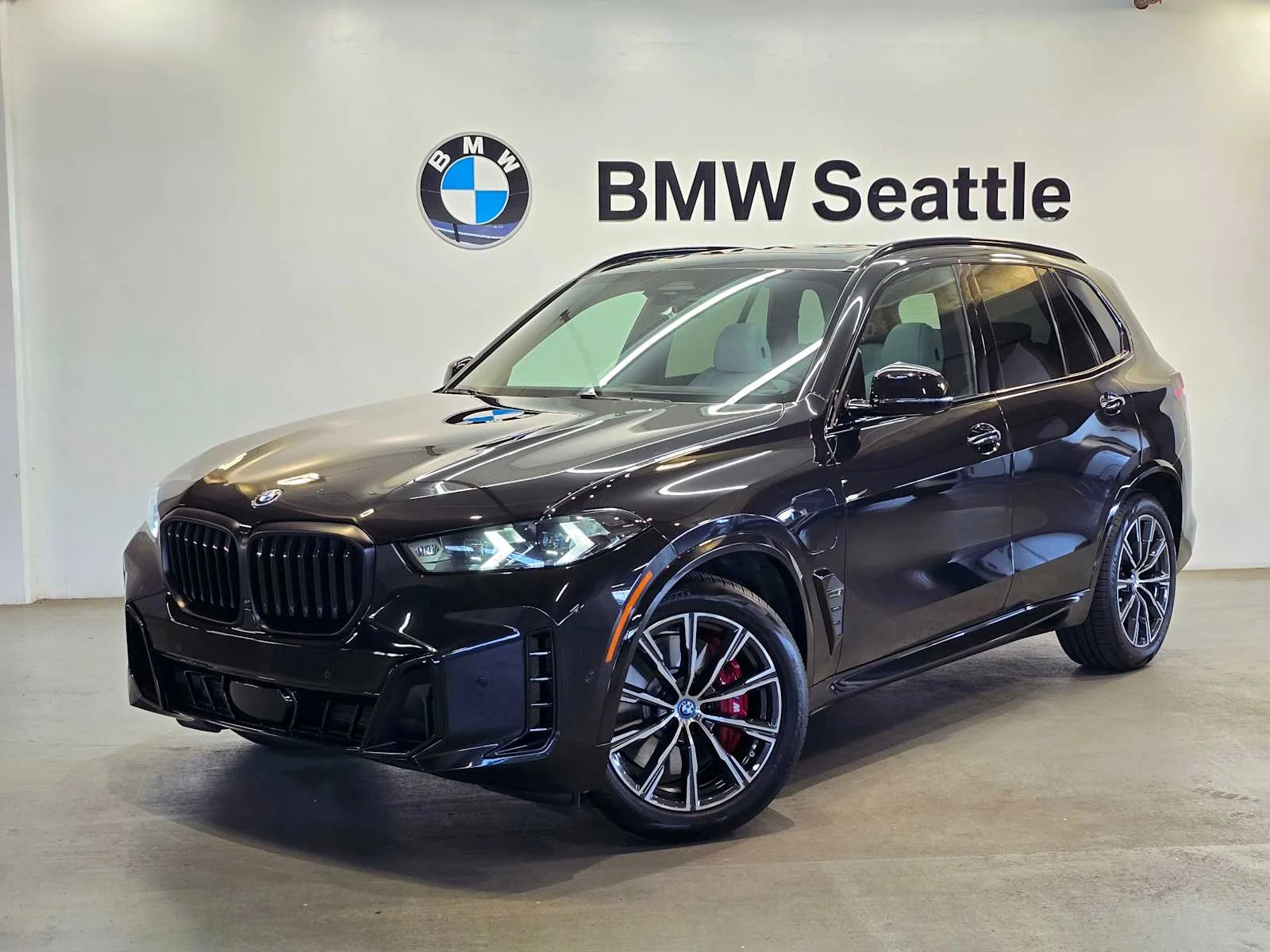 Used 2024 Black Sapphire Metallic BMW xDrive50e image 1