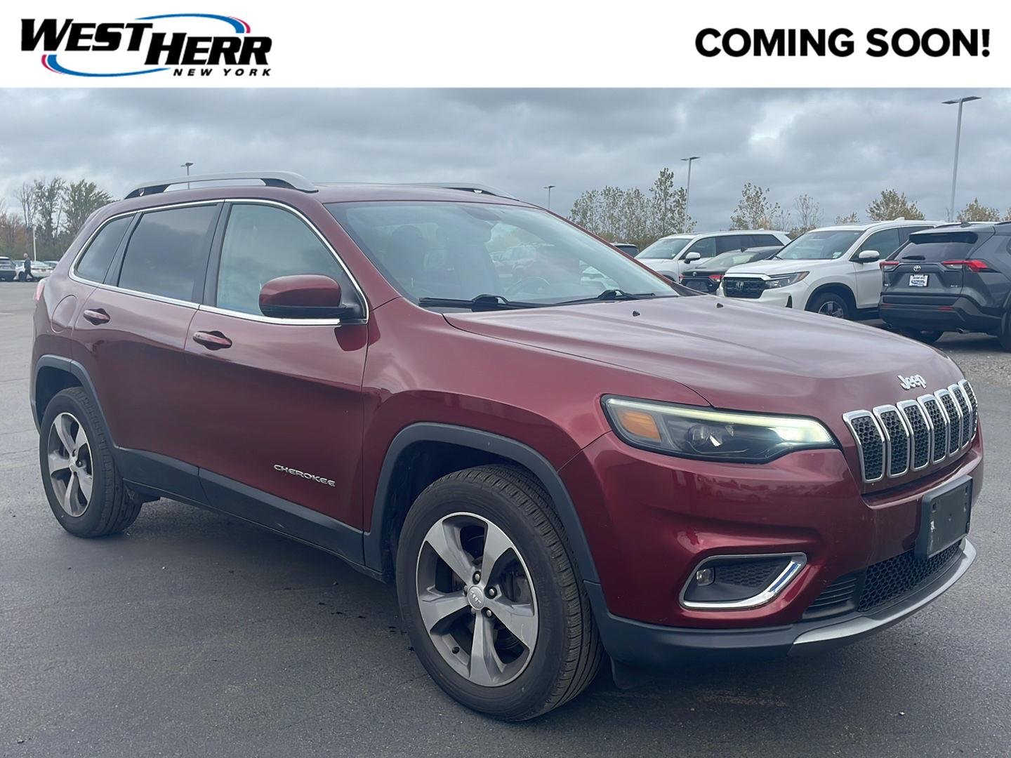 Used 2019 Velvet Red Pearlcoat Jeep Limited image 1