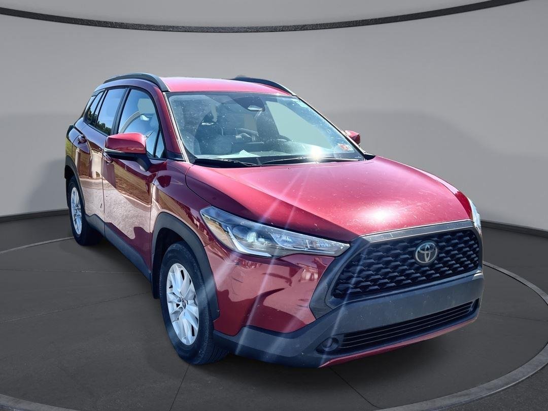 Used 2023 Barcelona Red Metallic Toyota LE image 1
